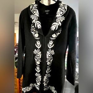 Wool jacket with white embroidery in floral design.